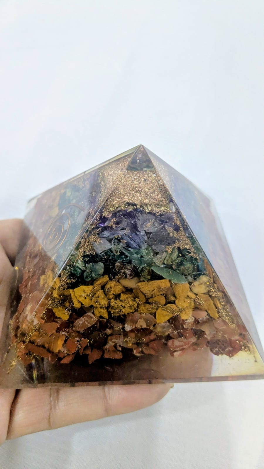 Seven chakra orgonite pyramids
